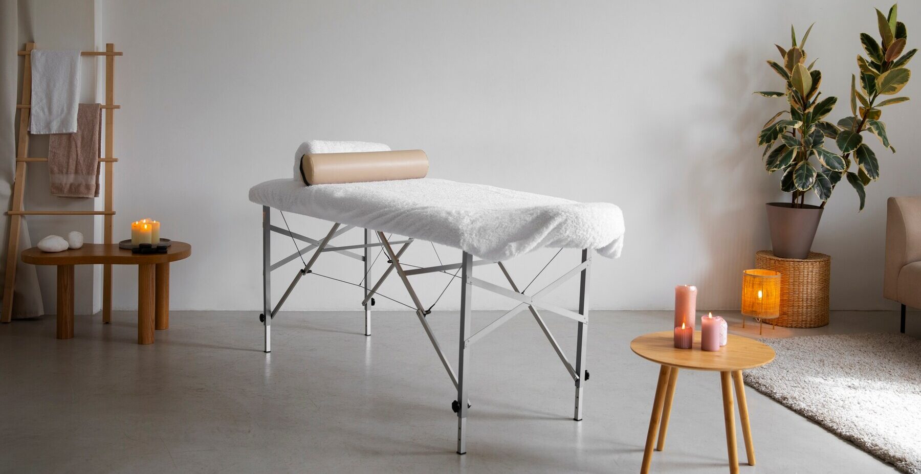 mobile massage vancouver massage bed with orange candle in grey room